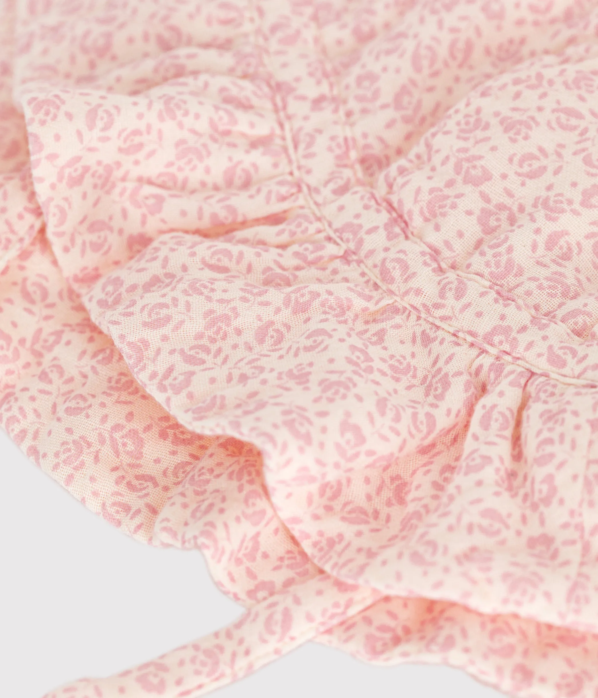 CAPPELLINO A FIORI ROSA IN GARZA DI COTONE BEB