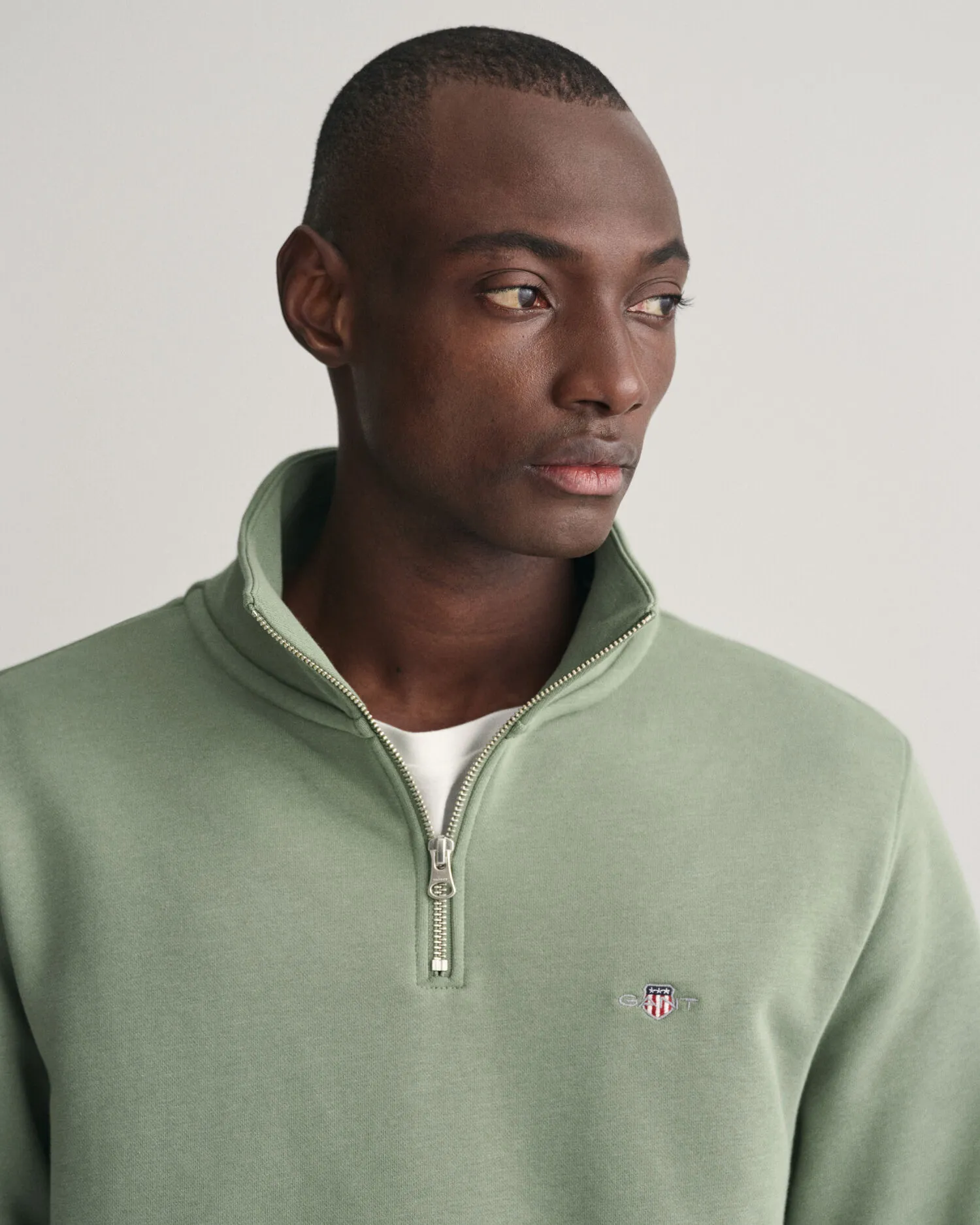 Felpa Shield con zip corta    