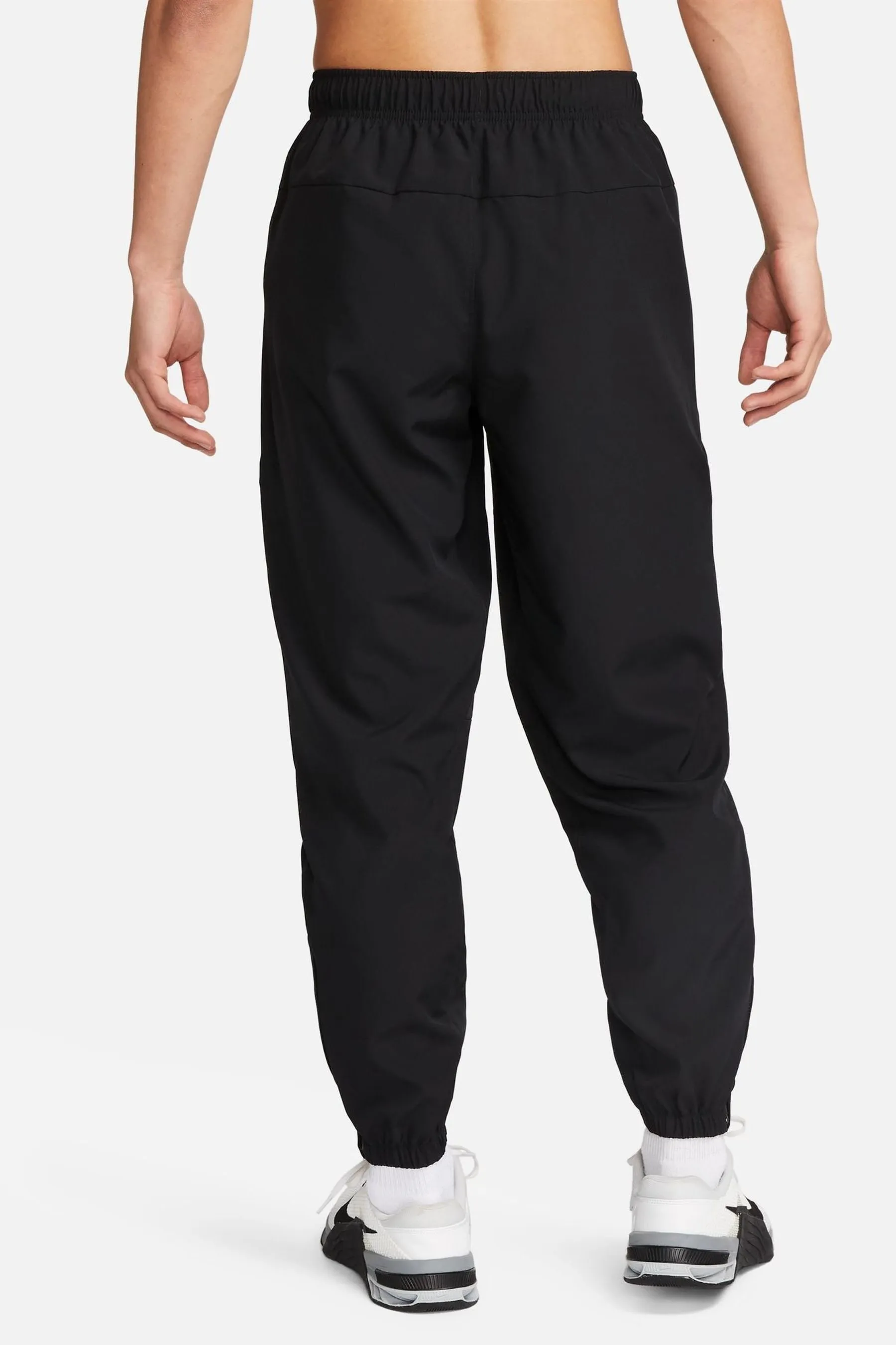 Nike - Pantaloni da jogging da allenamento Dri-FIT stretti in fondo