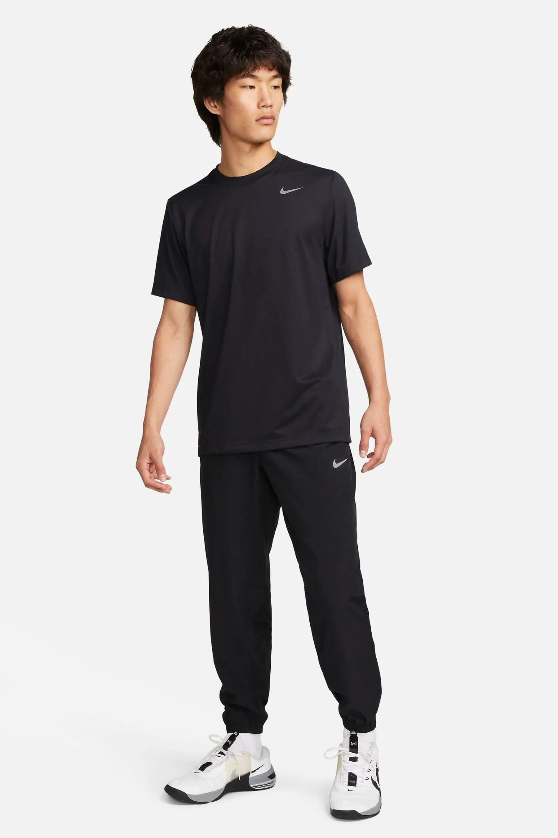 Nike - Pantaloni da jogging da allenamento Dri-FIT stretti in fondo