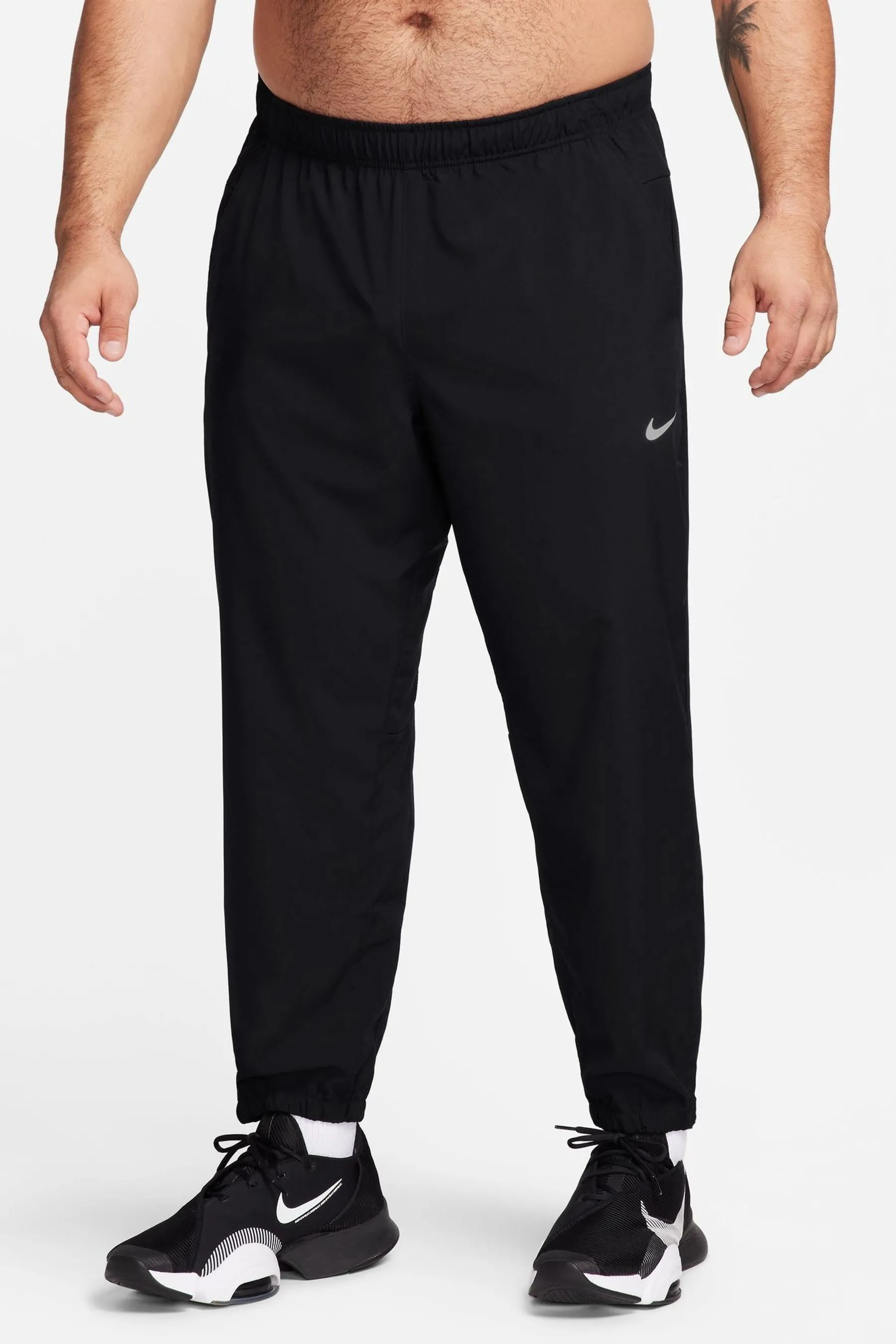 Nike - Pantaloni da jogging da allenamento Dri-FIT stretti in fondo