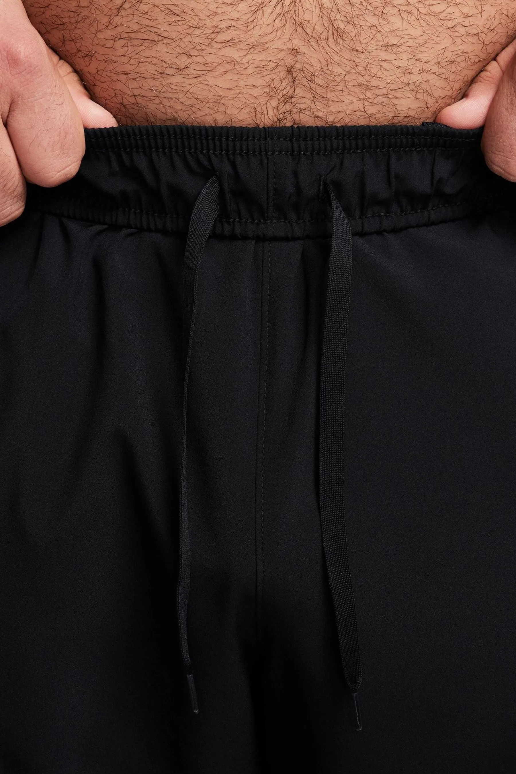 Nike - Pantaloni da jogging da allenamento Dri-FIT stretti in fondo