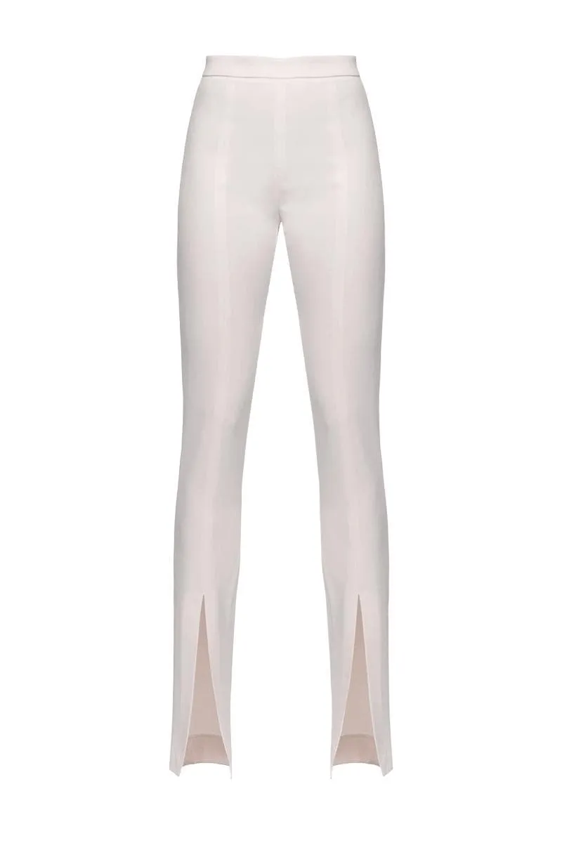 Pantaloni aderenti con spacco al fondo