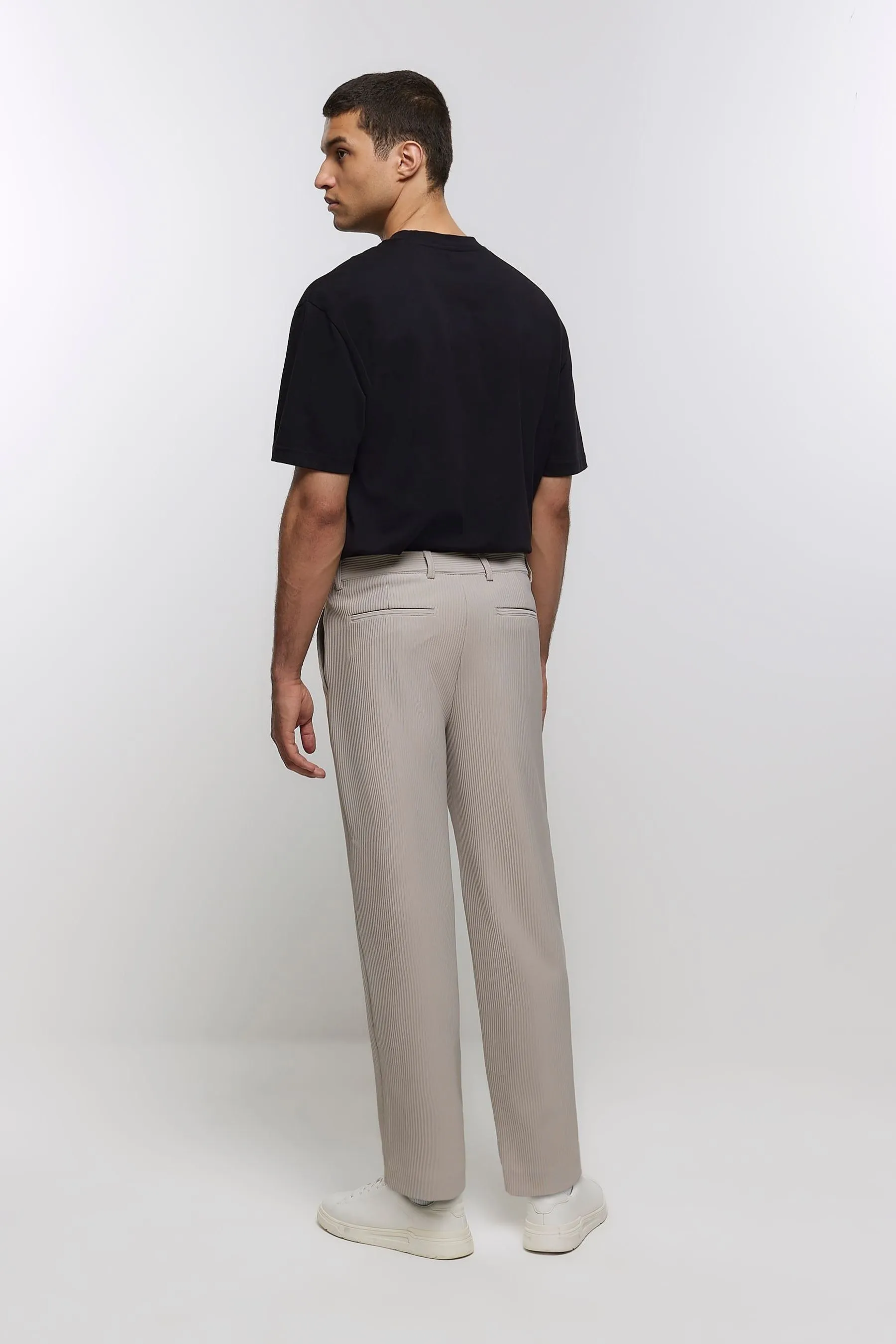 River Island - Pantaloni plissé stretti in fondo